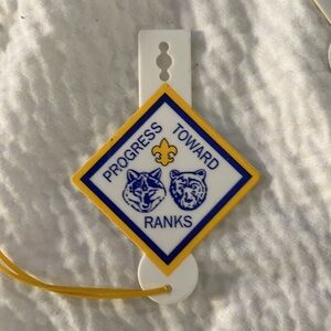 Cub Scouts progress toward ranks pocket badge